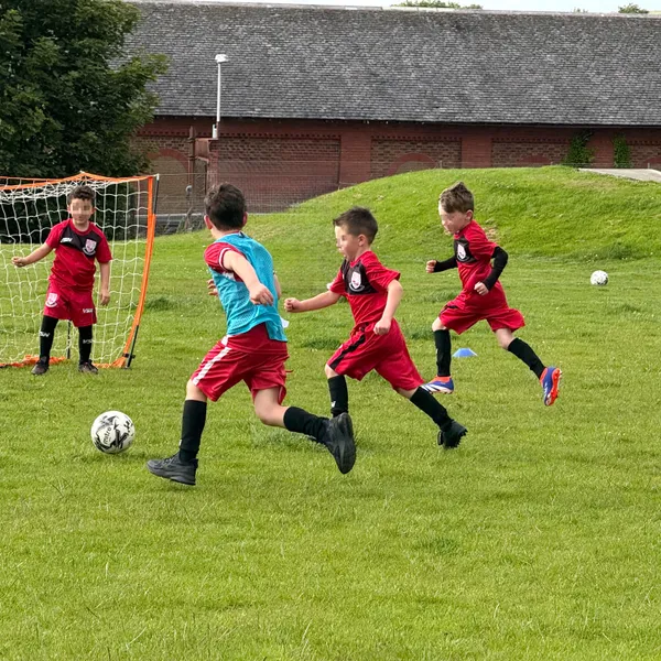 A Neilston FC Youth Academy squad with their coaches